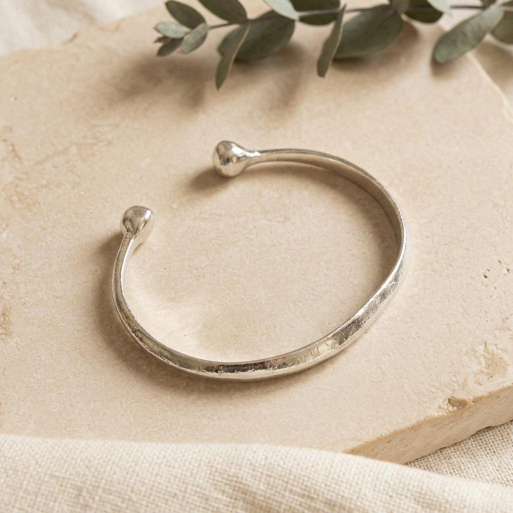 Bangle styled with natural stone, linen and greenery